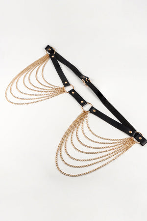 Cascading chain waist harness in black with gold chains and hardware.
