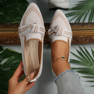 White knit pointed flats with chain-stitched trim and bow detail