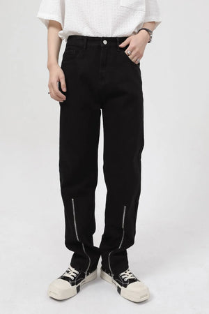 Dark relaxed fit denim jeans with zip hems