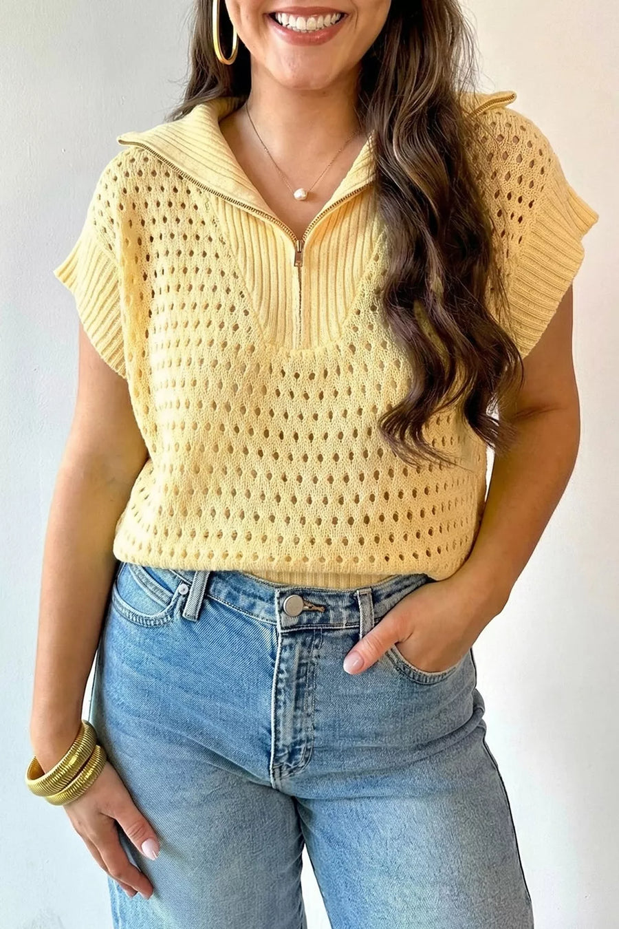 Pastel yellow hollowed knit zipper collar top with short sleeves.