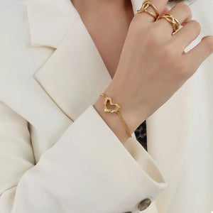 18K Gold-Plated, Titanium Steel Care instructions: Avoid wearing during exercise bracelet in Gold with n/a silhouette