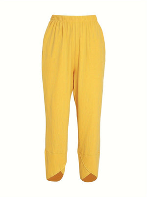 Yellow relaxed fit wide-leg pants with elastic waist and tulip hem detail.