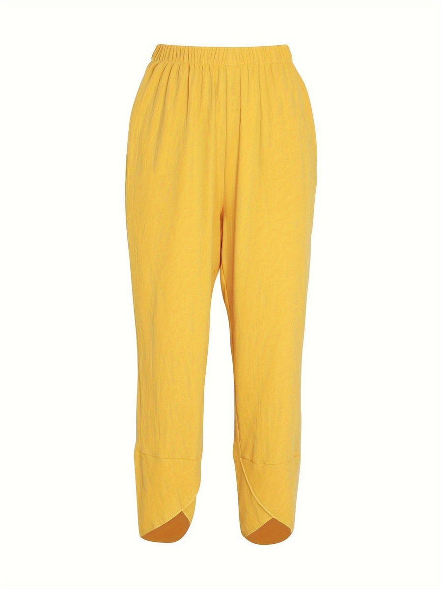 Yellow relaxed fit wide-leg pants with elastic waist and tulip hem detail.