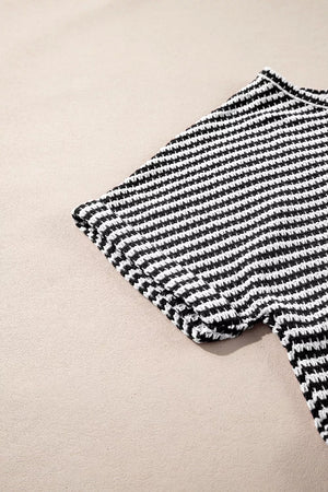 Textured knit t-shirt with black and white stripes and a notched neck.