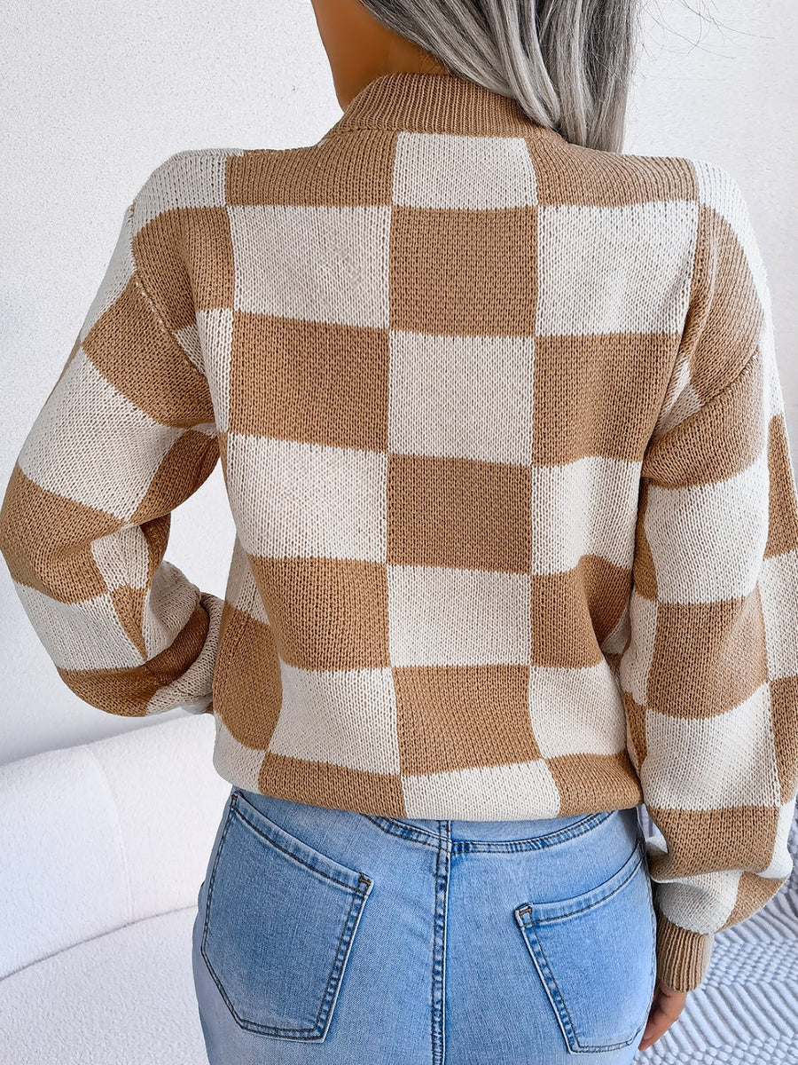 Checkerboard knit mock neck pullover in camel and cream acrylic with long sleeves.