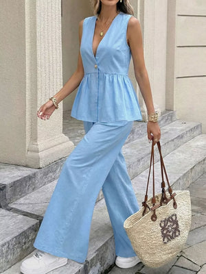 Blue V-neck sleeveless peplum top and wide-leg pants set with button detail.
