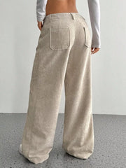 Chic wide-leg corduroy trousers in apricot with back pockets and a relaxed fit.