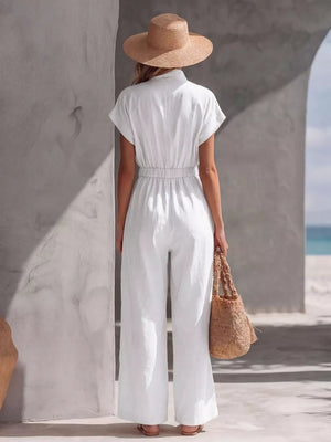 White wide-leg jumpsuit with short sleeves and elastic waist, shown from the back.