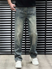 Men's relaxed fit jeans in vintage wash blue cotton with distressed detailing.
