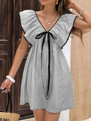 Ruffled sleeve mini dress with black bow and pinstripe pattern.