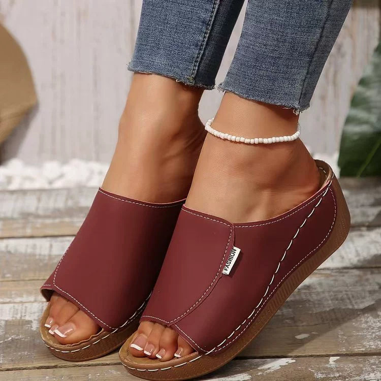 Casual chic open-toe wedge sandals in red with white stitching and a small "Fashion" tag.