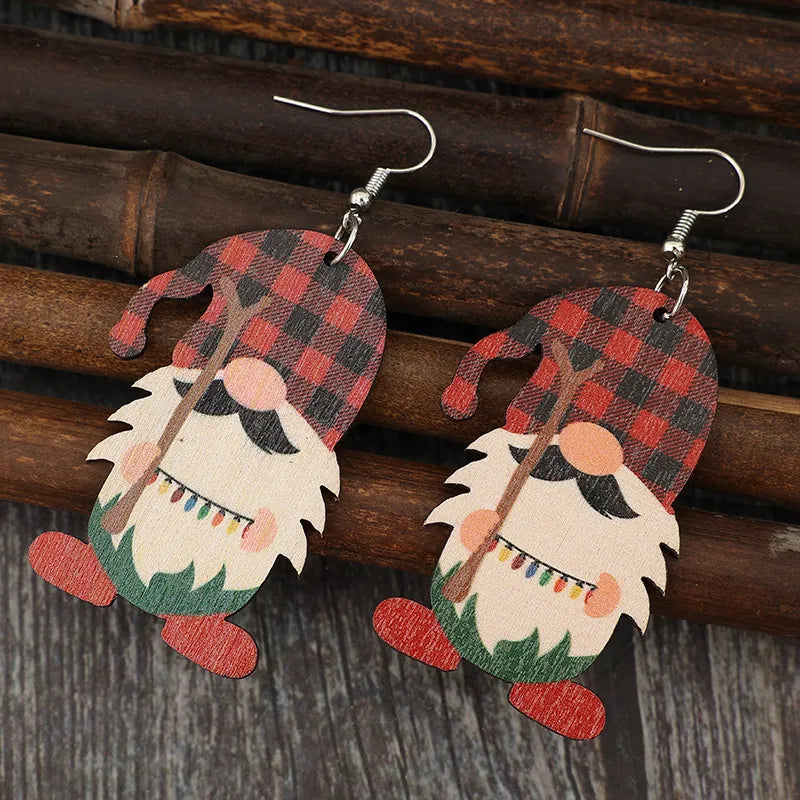 Plaid gnome dangle earrings in deep red with festive lights detail.