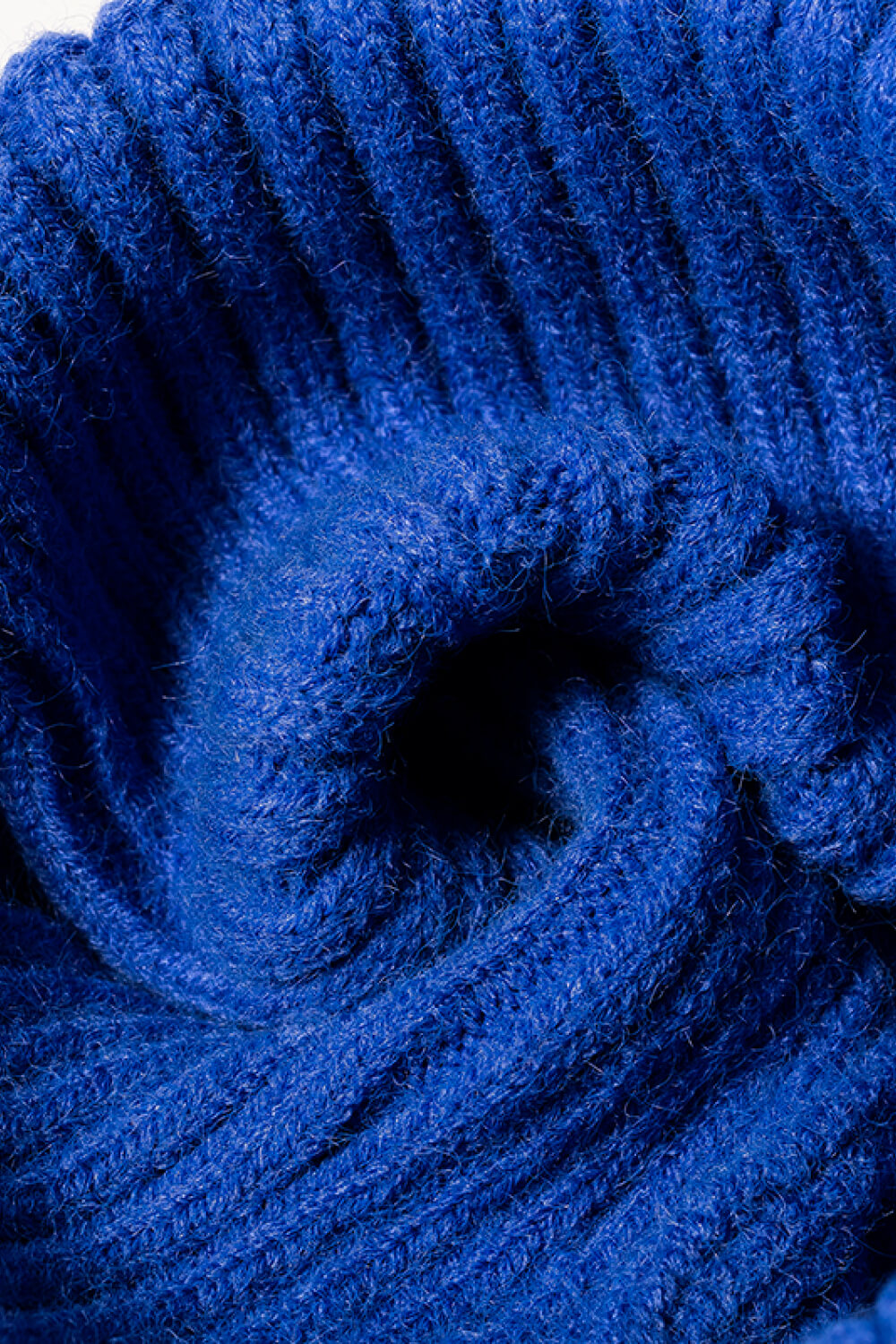 Blue chunky ribbed knit beanie with acrylic material detail