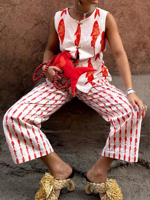 Red fish print sleeveless top and cropped pants set with button details.