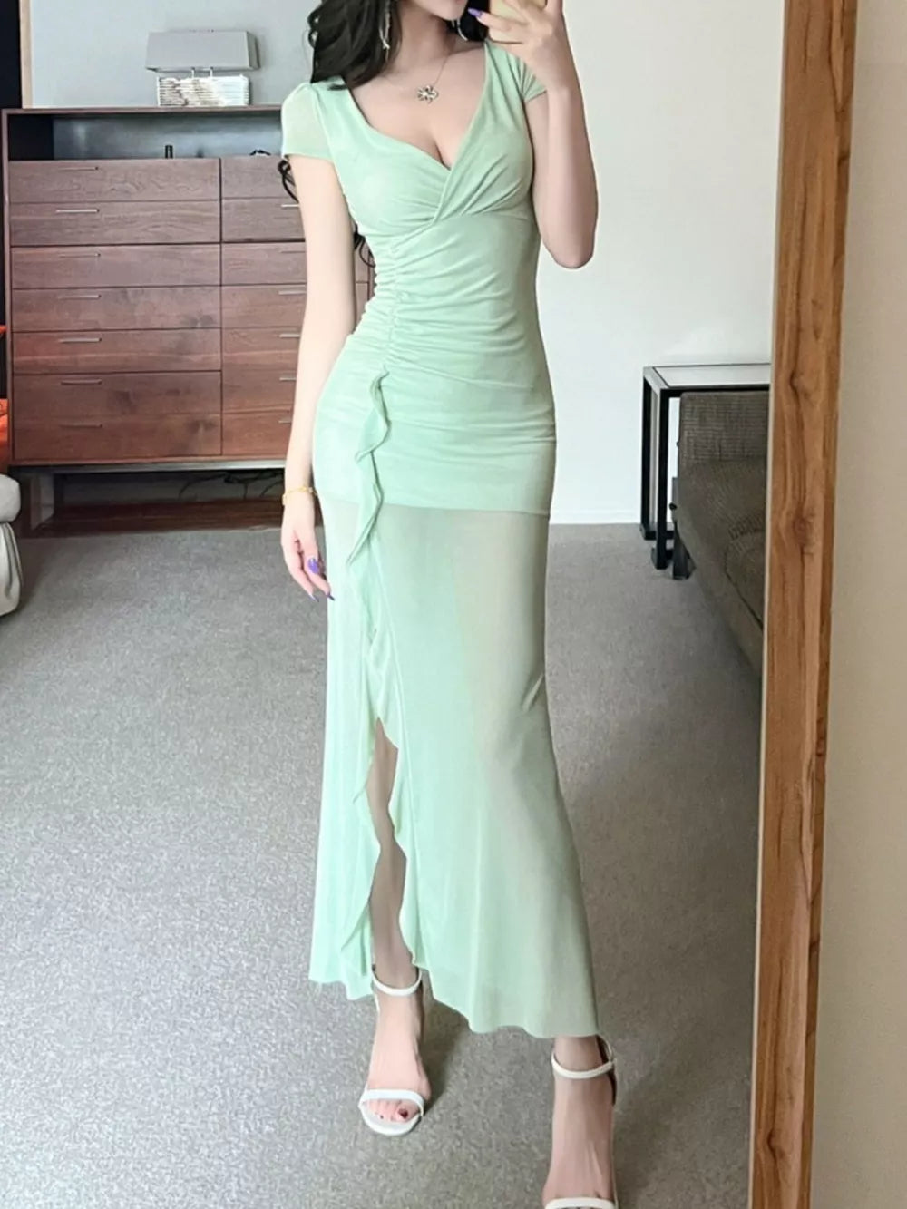 Light green surplice ruffle maxi dress with ruched sides and a high slit.