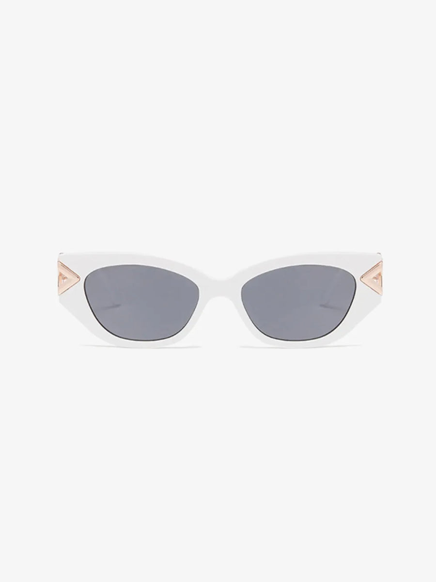 White cat-eye sunglasses with gold geometric accents and grey lenses