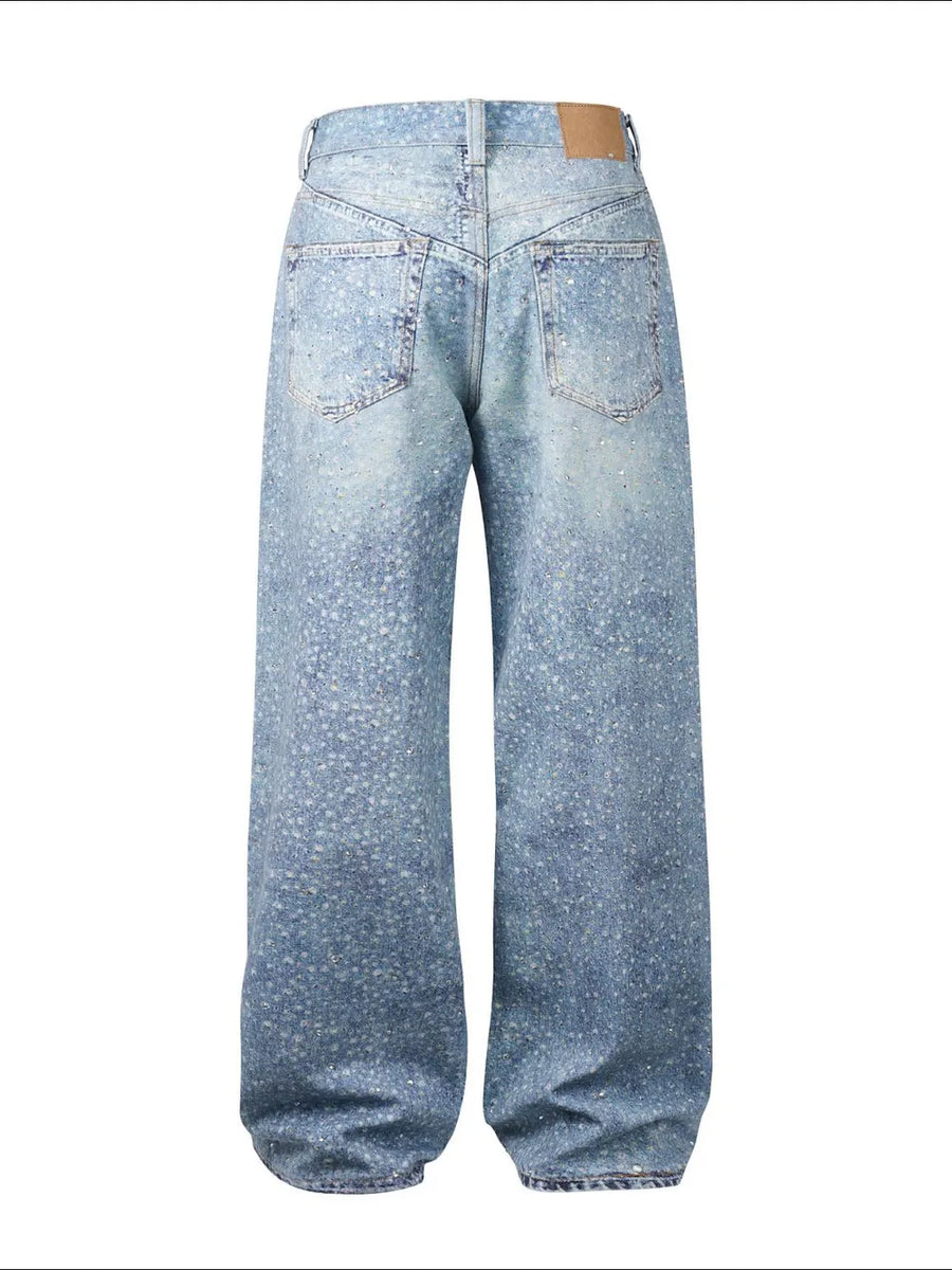 Embellished wide-leg denim trousers in medium wash with all-over sparkle details.