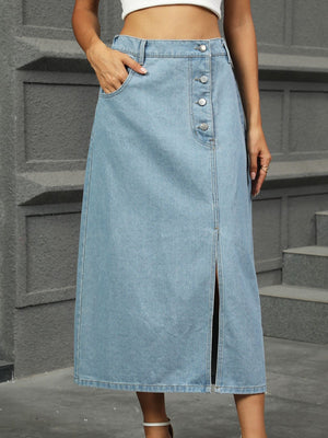 Button-front A-line denim midi skirt in medium wash with a side slit and pockets.