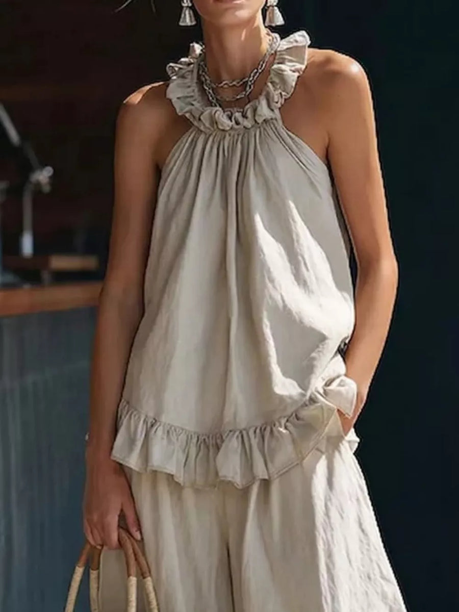 Apricot ruffled halter neck top and wide-leg pants set with frill details.