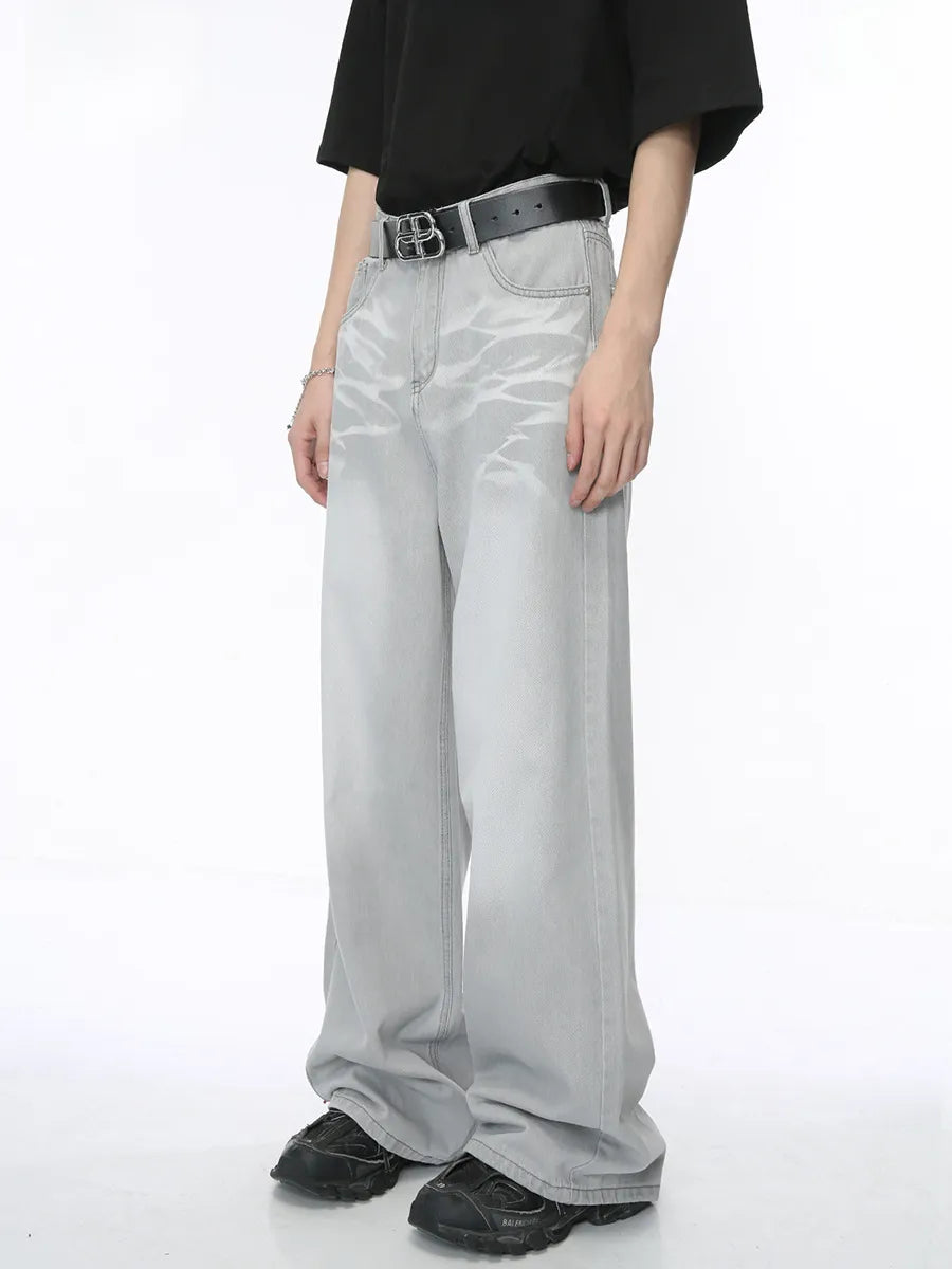Light wash straight leg denim jeans with whiskered details and a relaxed fit.