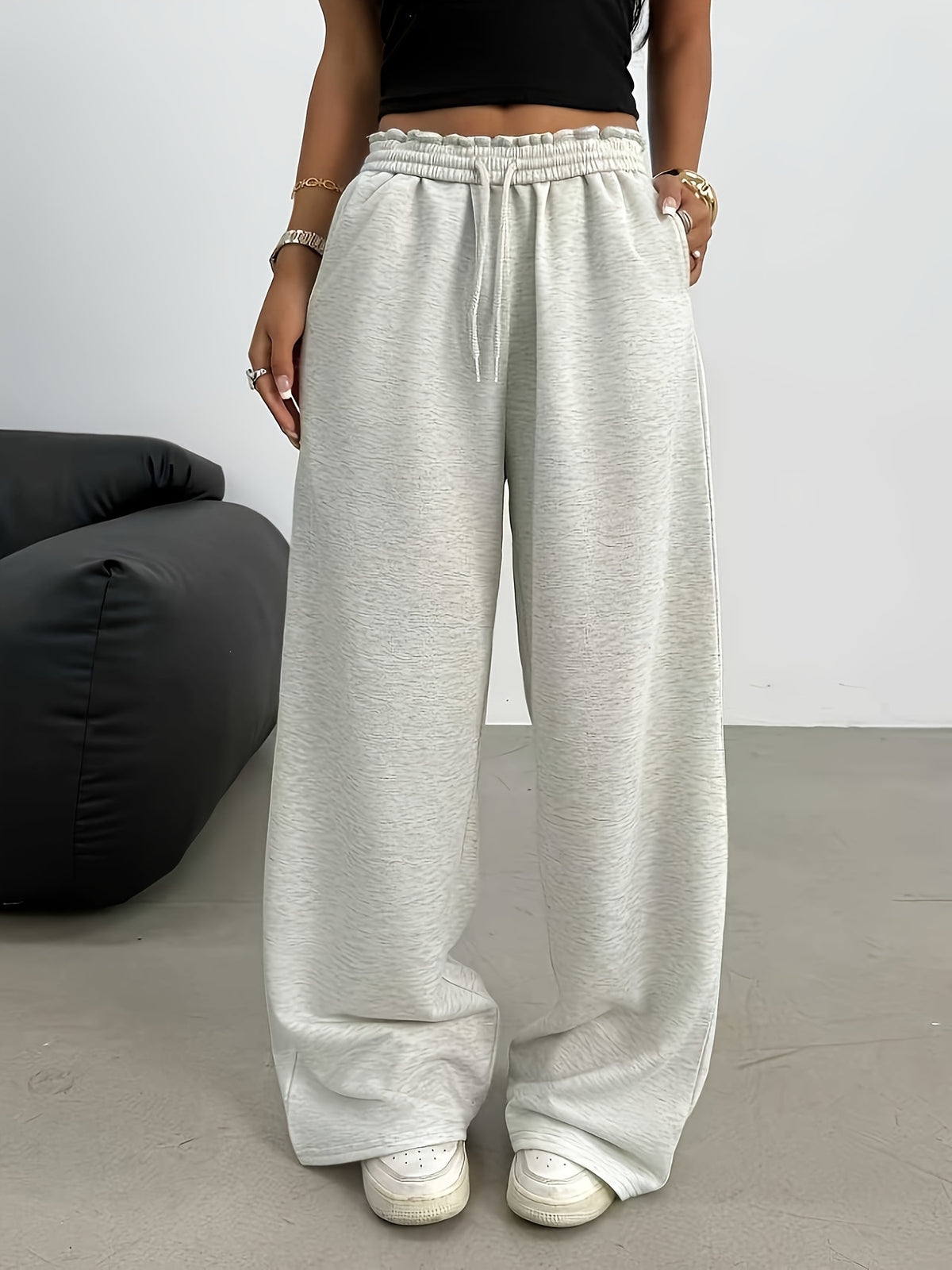 sweatpants in heather gray featuring drawstring and loose fit