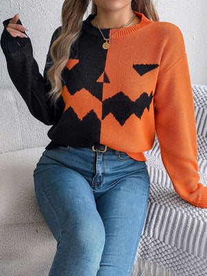 black pullover sweater featuring stretch and graphic