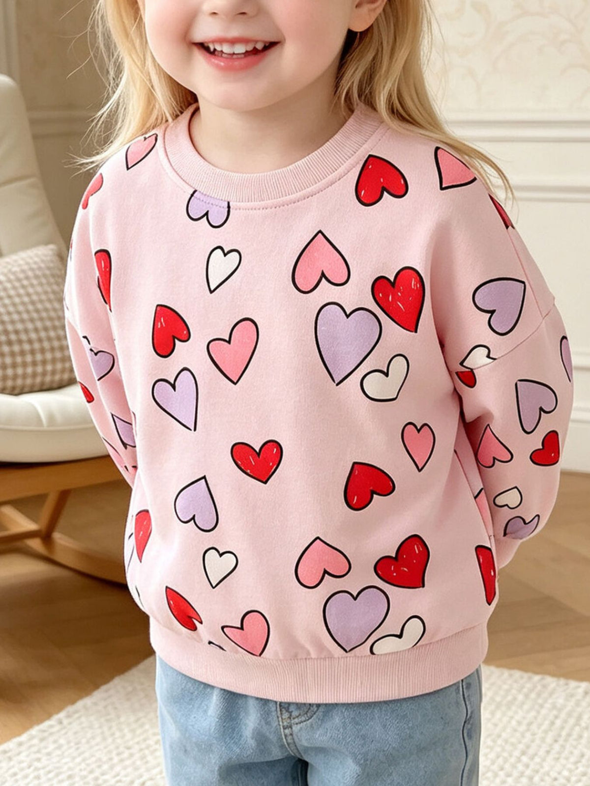 light pink sweatshirt with heart-print and crew neck