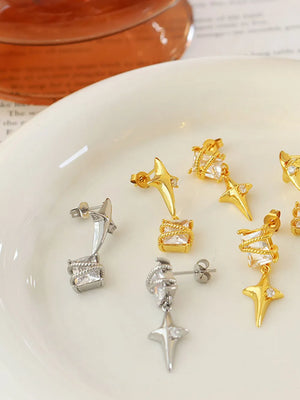 Celestial starburst crystal drop earrings in silver feature a square crystal and star charm.