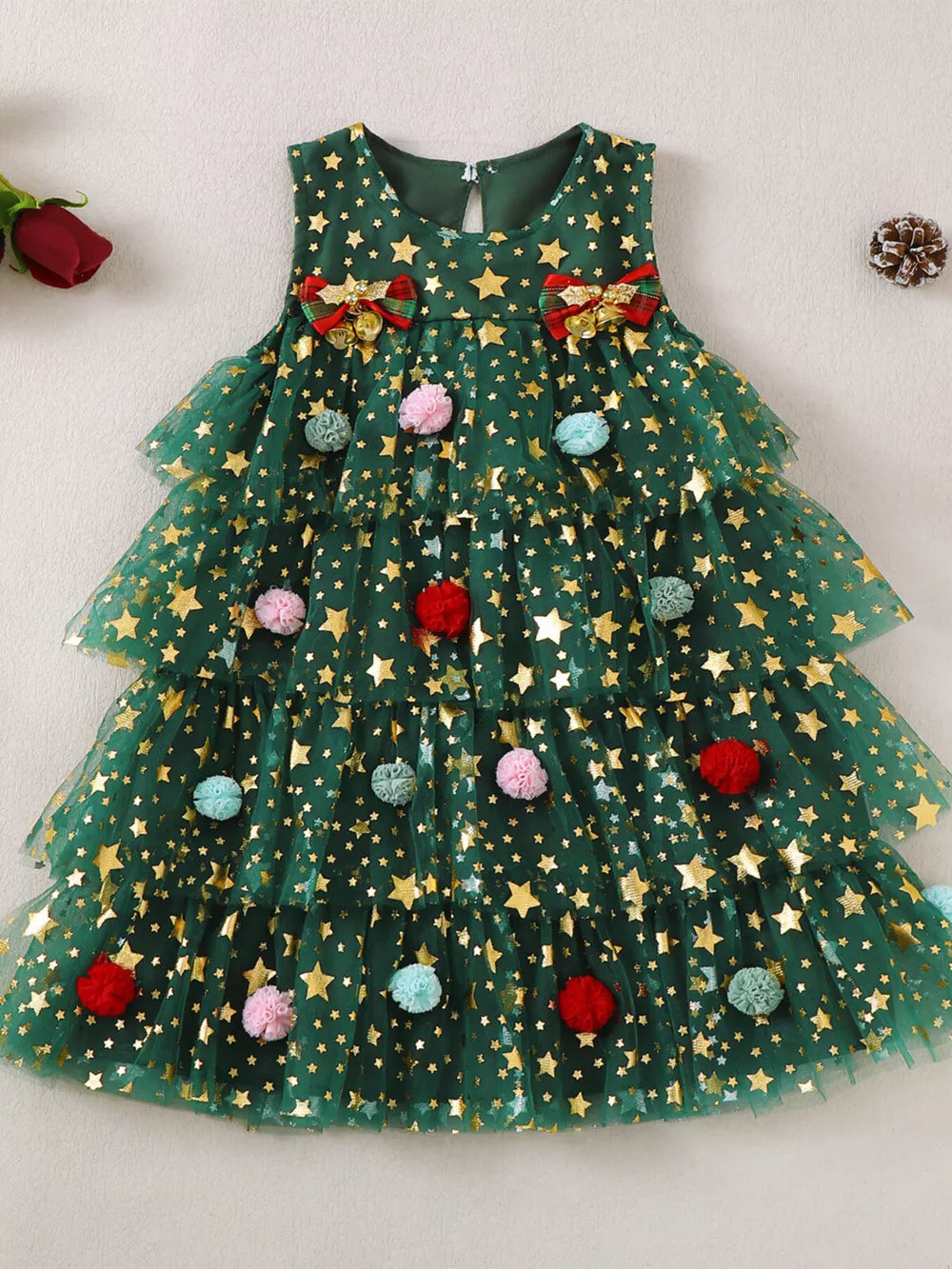 Green star print tulle dress with pom-poms and bows