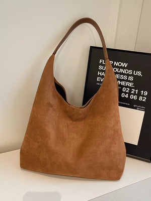 Elegant suede hobo tote mini in brown with a single strap.