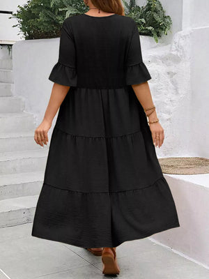 Black tiered midi dress with ruffle sleeves and crinkled texture