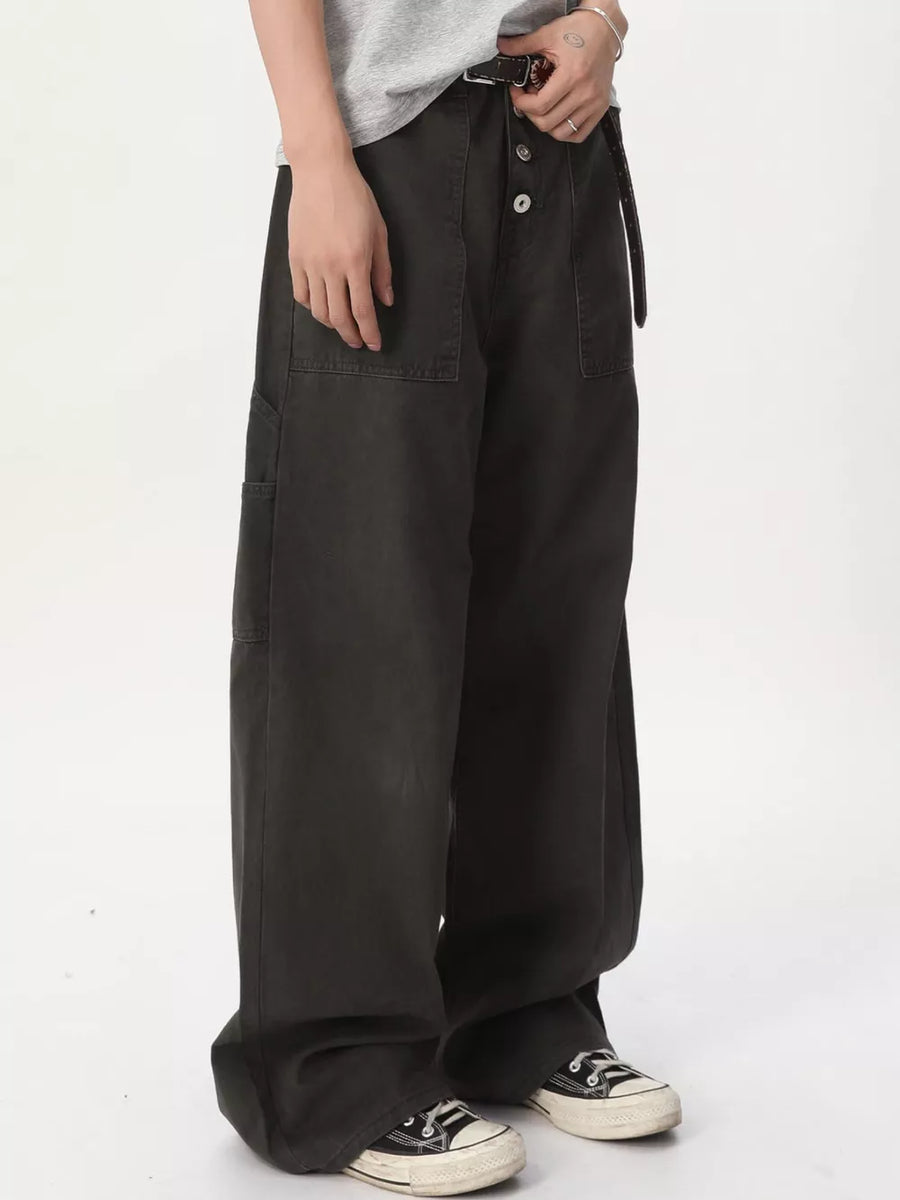 Black cotton relaxed wide-leg cargo pants with button fly and large side pockets.