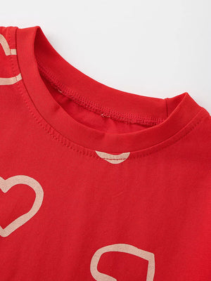Red cotton t-shirt for kids with allover heart print and crew neck.