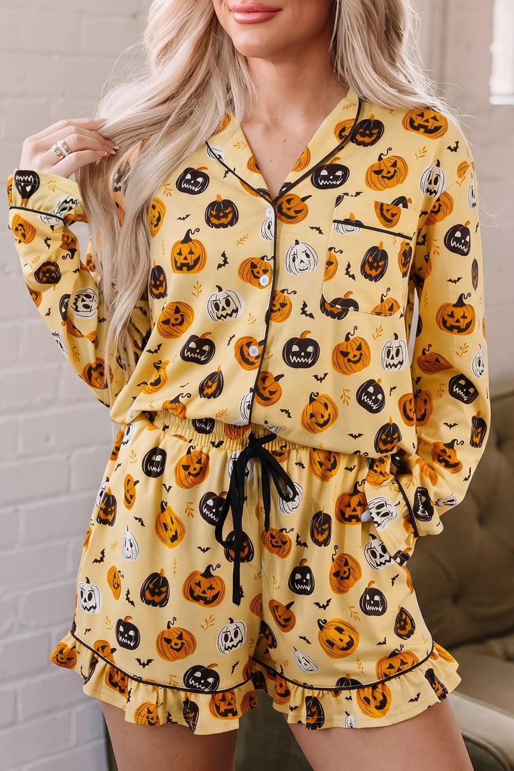 light yellow pajama set with pumpkin-print and collared