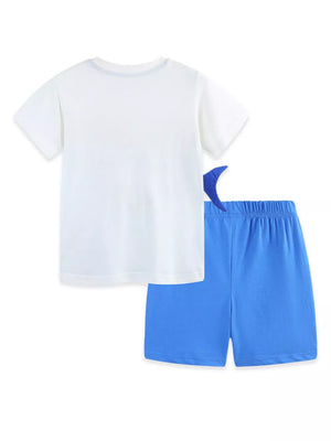 Toddler boys' white cotton tee with blue shark fin detail on blue shorts.