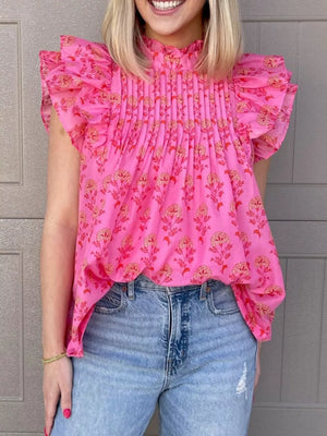 Pink floral print blouse with ruffled flutter sleeves and pintuck detail