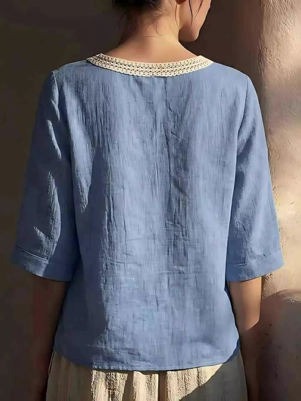 Blue linen blend top with crochet trim neckline and 3/4 sleeves
