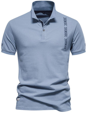 Dusty Blue piqué polo shirt with chevron embroidery on chest and sleeve.