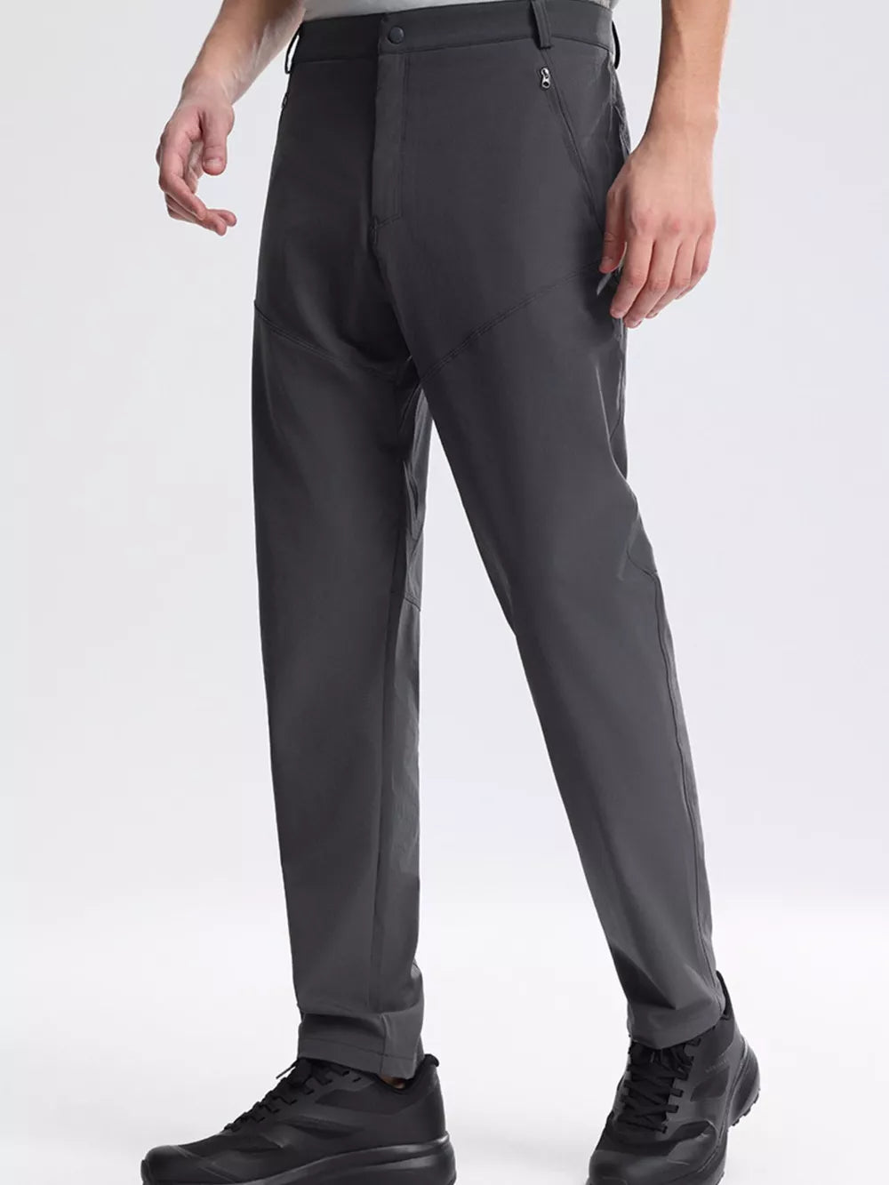 Men's dark gray sweatpants with zippered pockets and a comfortable fit.