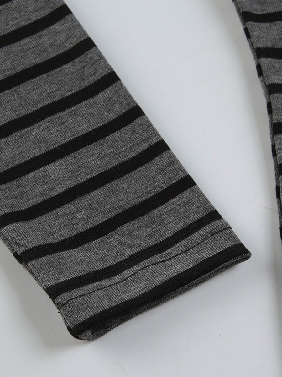 Grey and black striped t-shirt with a boat neck and long sleeves.