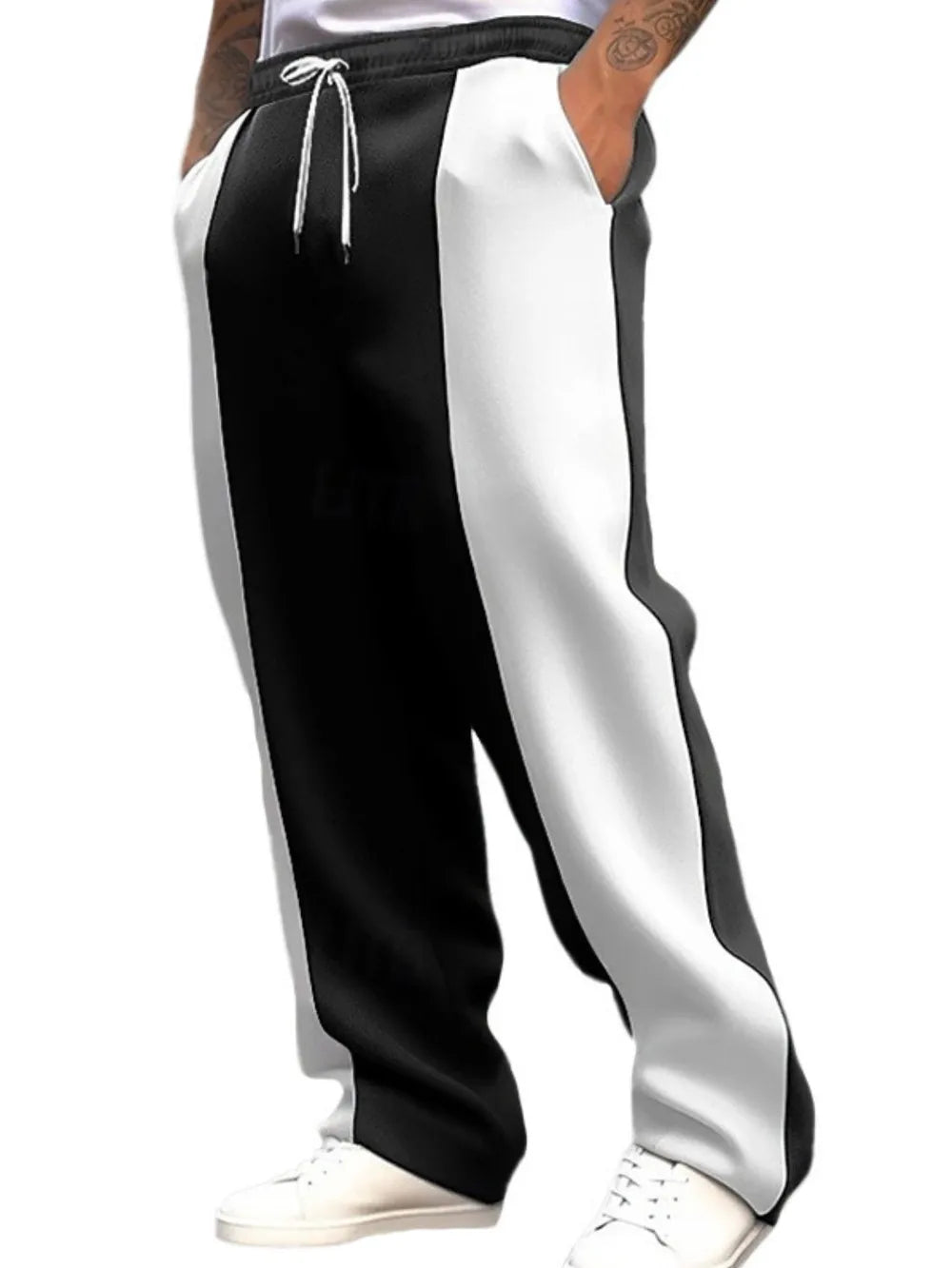 Panelled track pants in black and white with drawstring waist and pockets.