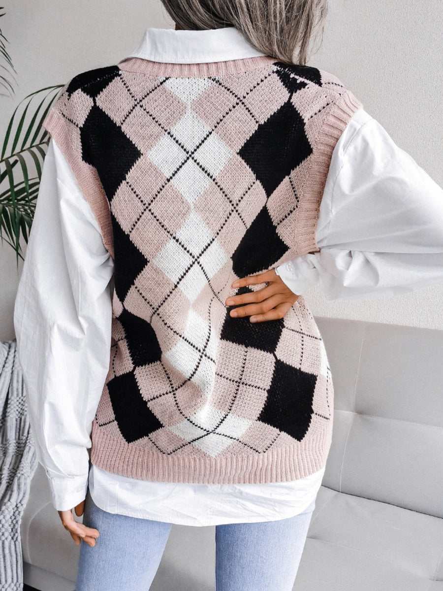 Argyle knit sweater vest in dusty pink with black and white diamonds, V-neck, sleeveless.