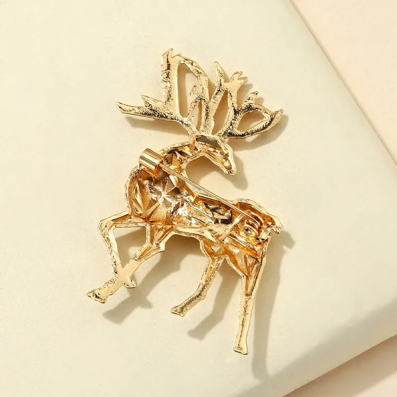 Gold geometric stag brooch made of alloy with intricate detailing.