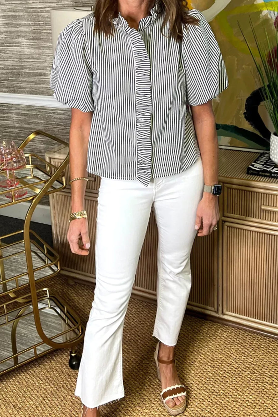 Maternity striped ruffle shirt with puff sleeves and button front, styled with white jeans.