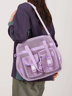 Lavender mesh crossbody bag with unique buckle accents and multiple pockets.