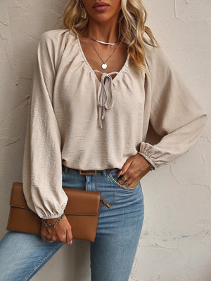 blouse in beige featuring tied and relaxed fit