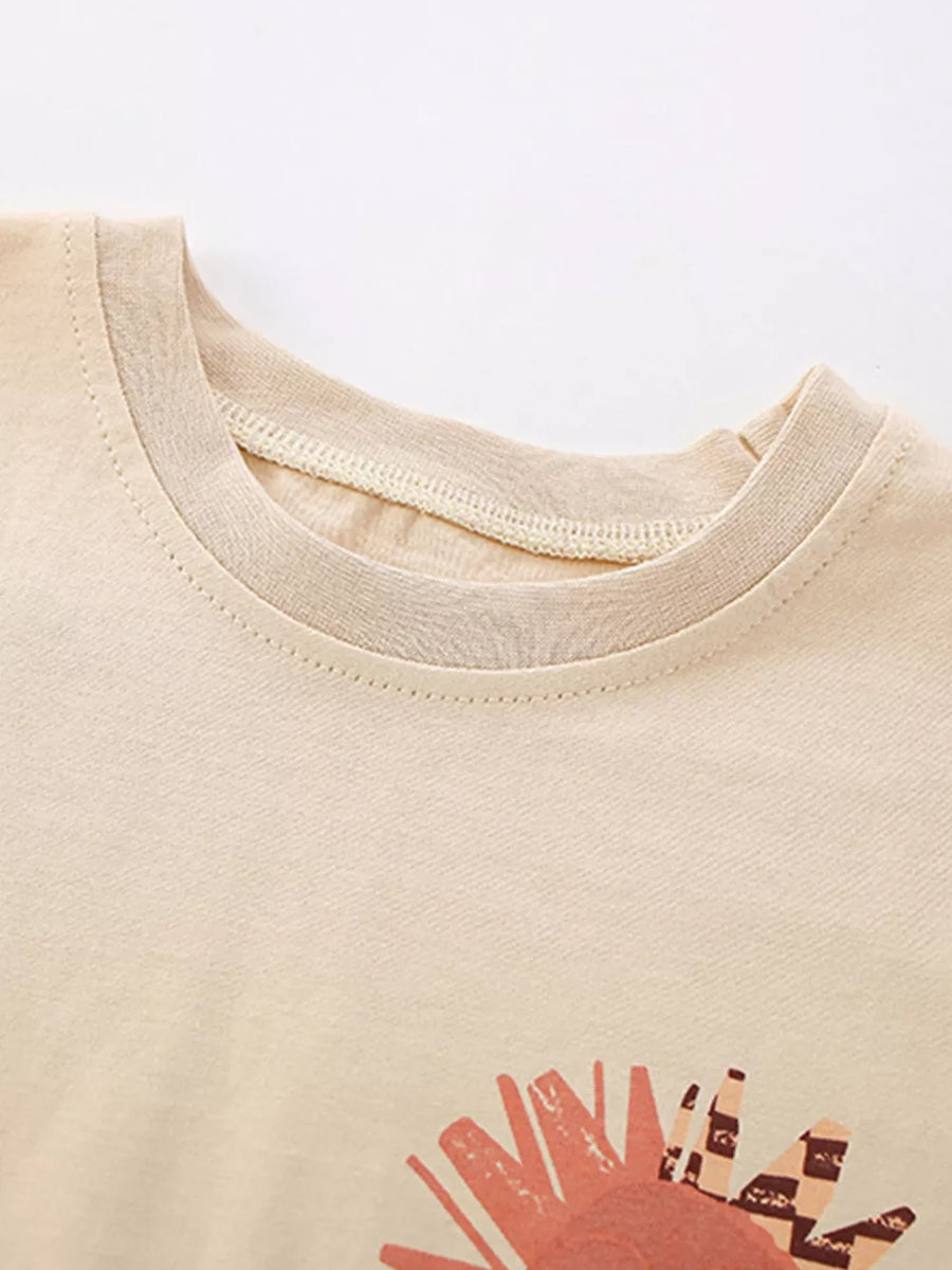 Toddler cotton t-shirt with sun graphic and checkered detail.