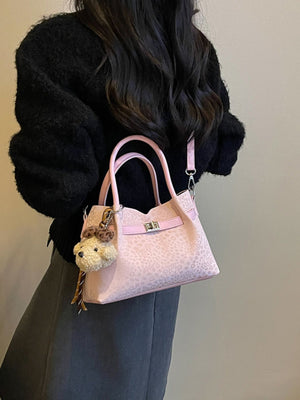 crossbody bag in Pink with leopard and buckle detail