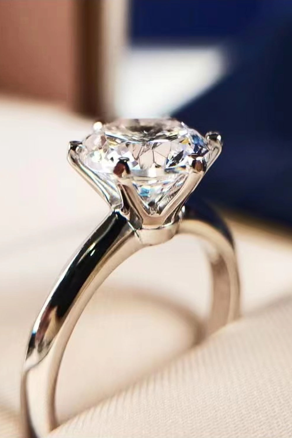 Silver engagement ring with a brilliant cut moissanite stone