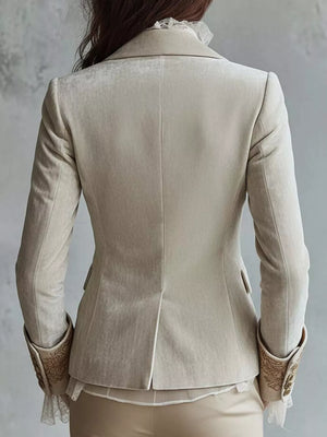 gold blazer featuring buttoned and floral